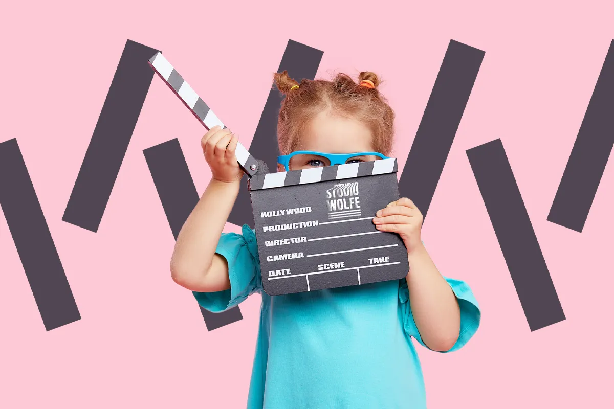 Young child with Studio Wolfe clapperboard